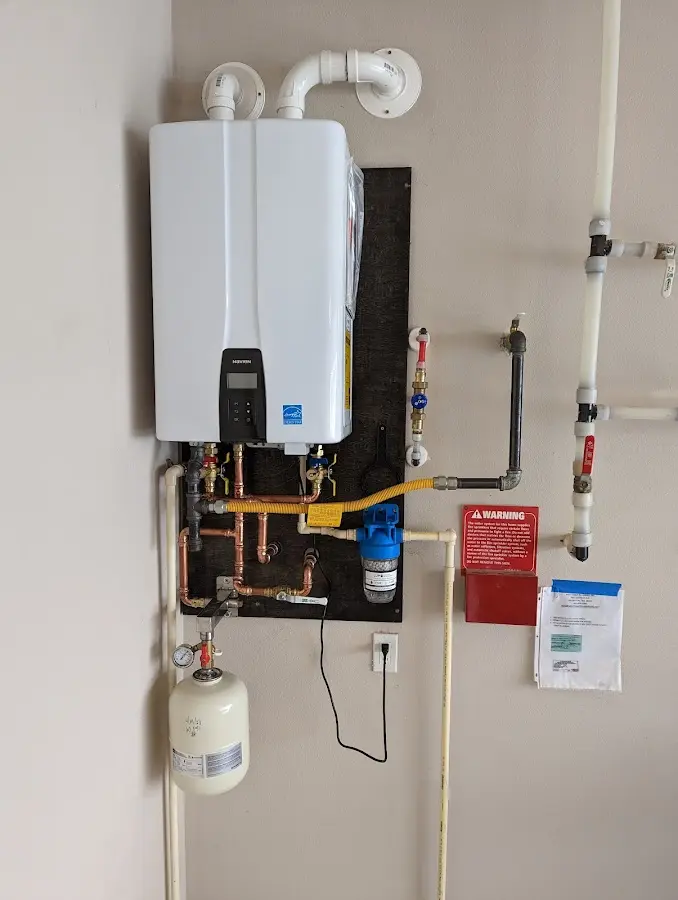 Professional plumber installing copper piping in a Daytona Beach home